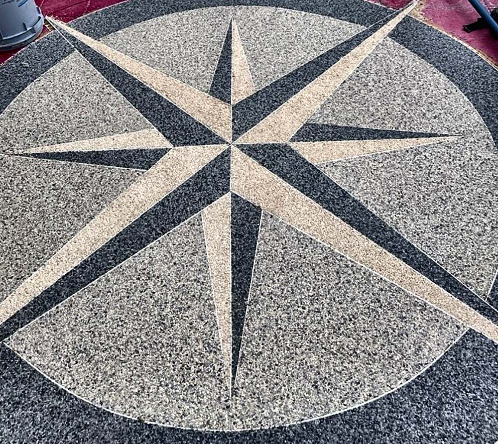 Custom compass rose inlaid in a pool deck