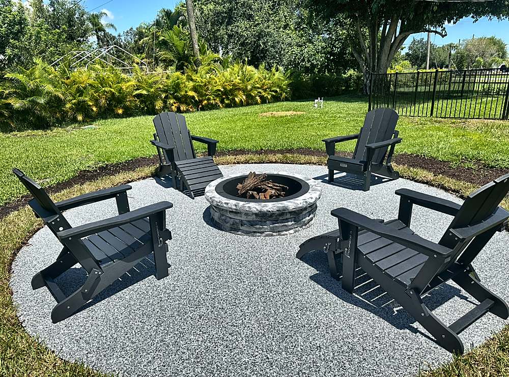 Finished round Vuba Stone fire pit patio with Adirondack chairs