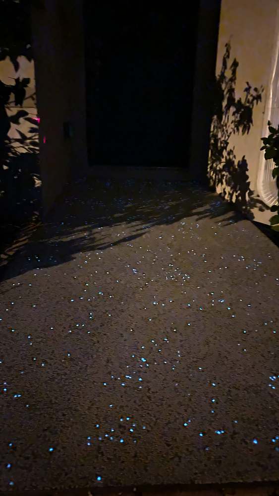 The same walkway at night, GlowStones glowing blue