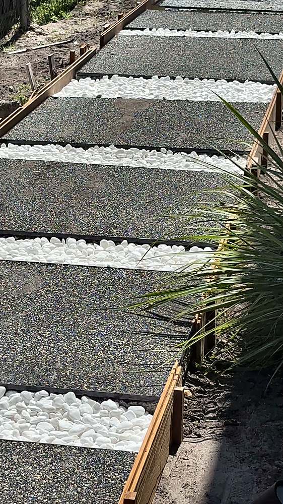 Modern Vuba Stone stepping-stone path with white pebble joints