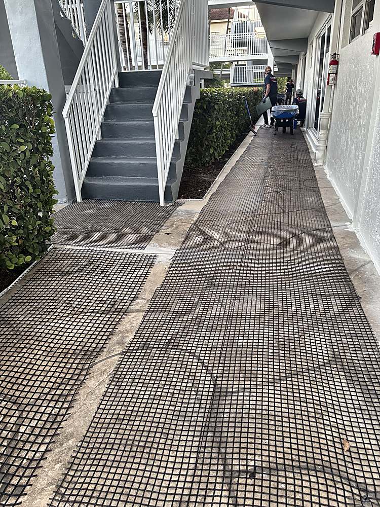 Condominium walkway during prep with reinforcement mesh laid over the old concrete