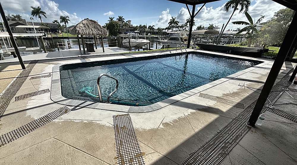Waterfront pool deck during prep, old concrete with reinforcement mesh